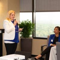 woman speaker addresses crowd